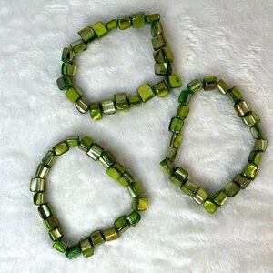 Three green spiny shell elastic bracelets.